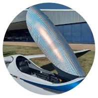 A blue and white airplane with a blue and white wing. Description generated by AI